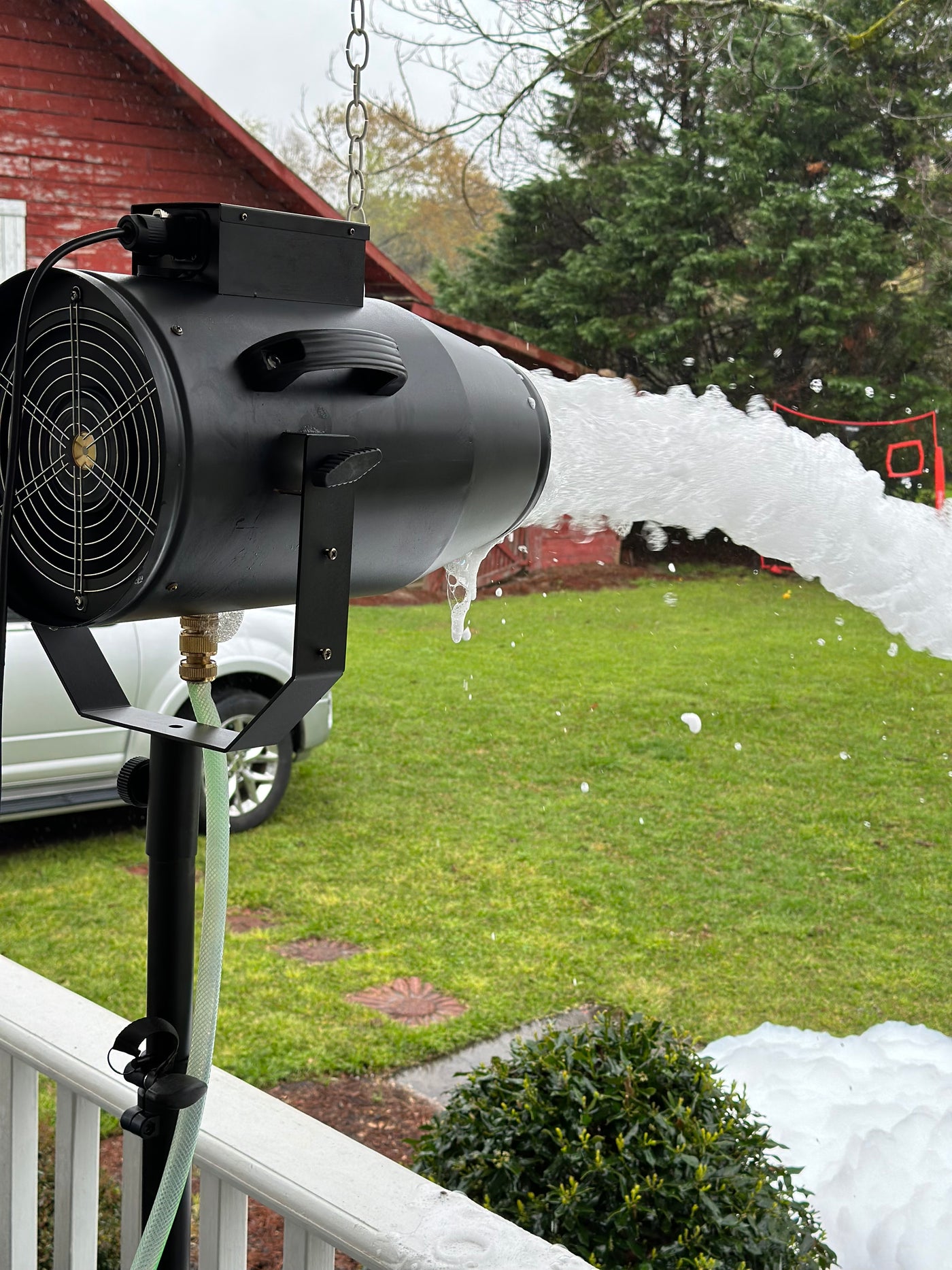 Set the foam cannon on the porch and watch the foam shoot out