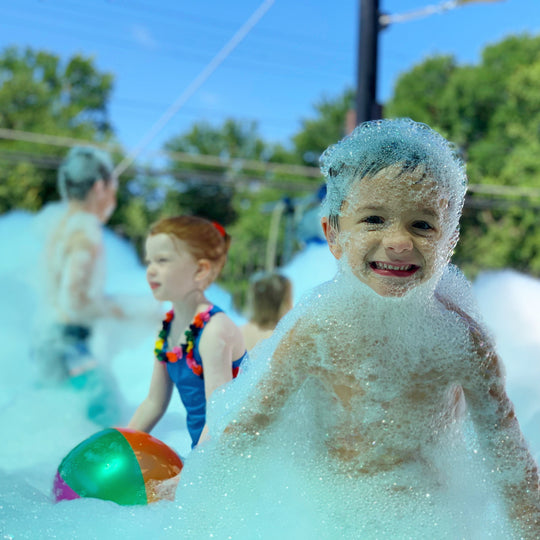 Foam Machines add to a daycare summer party.