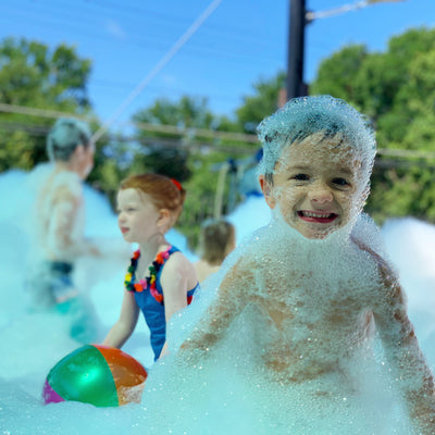 Foam Machines add to a daycare summer party.